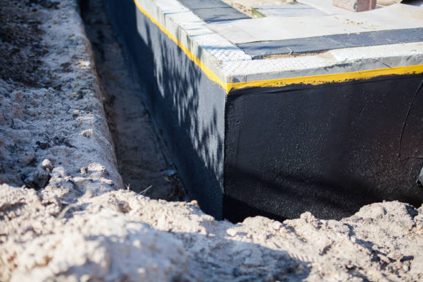 Professional Waterproofing technician working in Henderson, NC